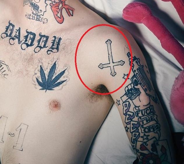Lil Peep cross tattoo on Right Shoulder
