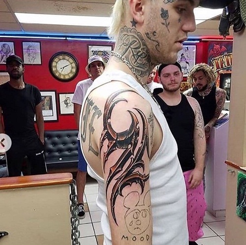 Lil peep tribal tattoo on right arm