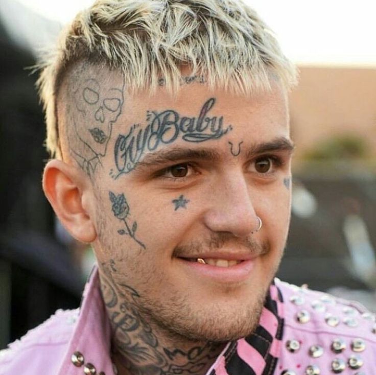 Lil peep star tattoo with rose on his face