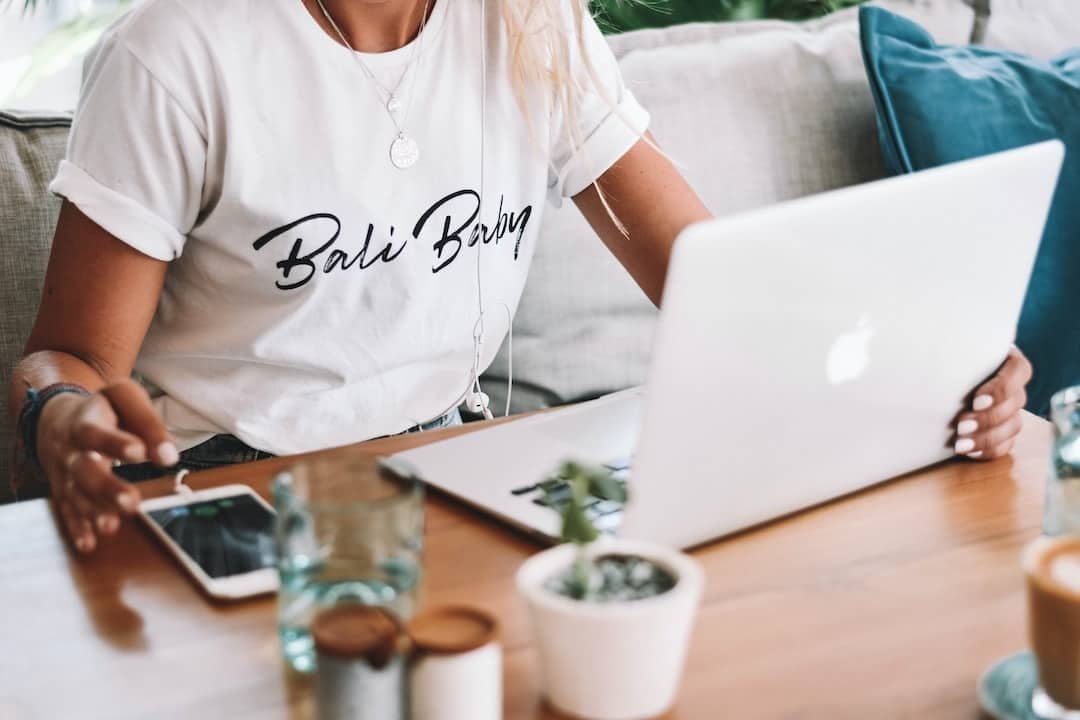 A writer going over a newsletter on her laptop